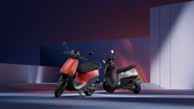 Top 5 electric scooters in India 2025 lined up with city background